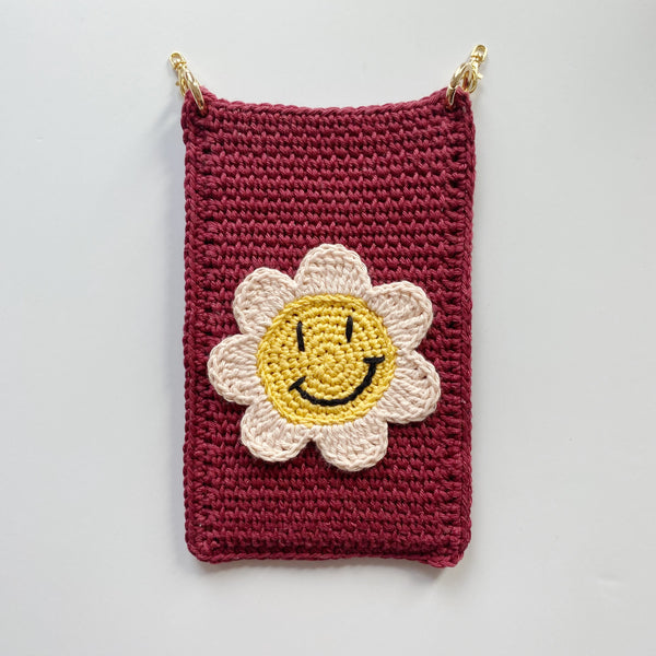 La pochette de téléphone "SMILEY FLOWER"